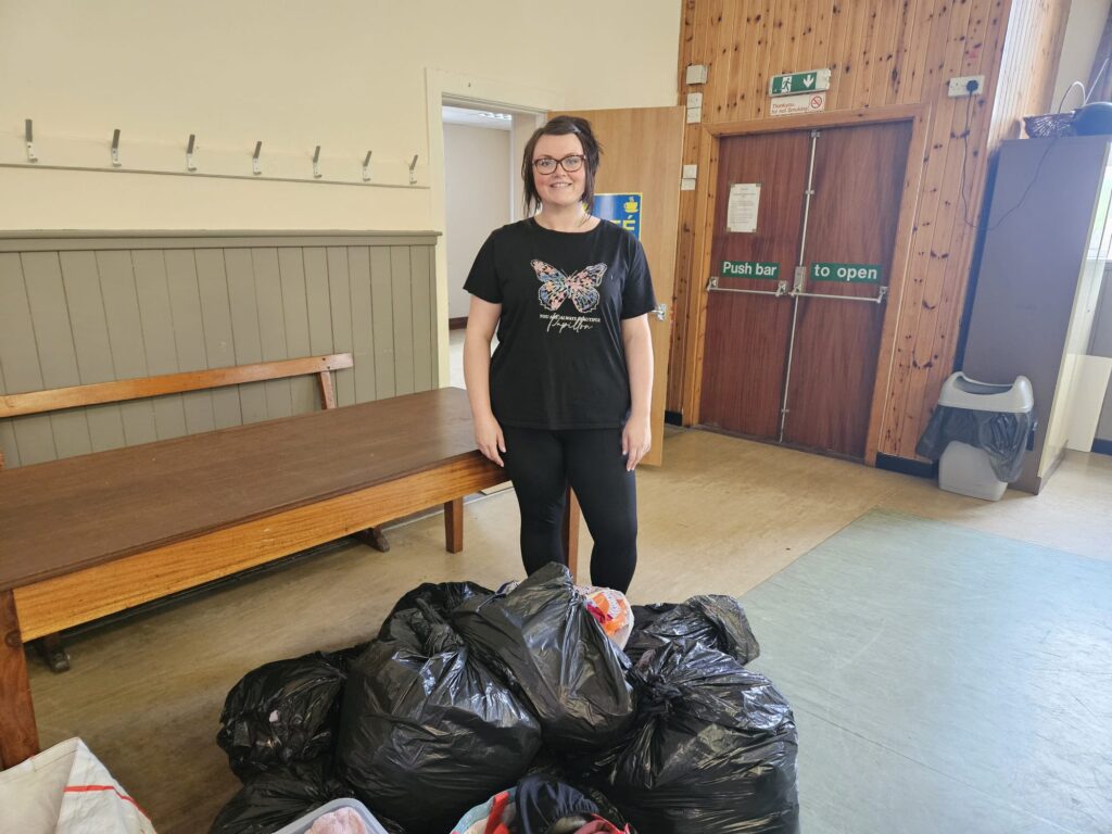 Bekki Williamson with all the donations from the Oldham Community Wardrobe