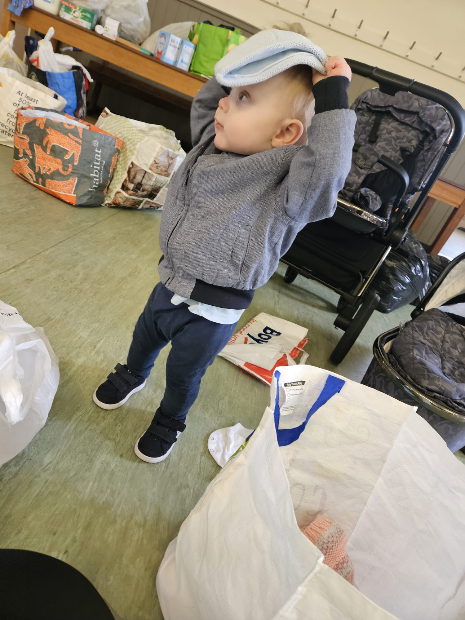 young child trying on some of the doantions for size