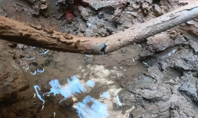 Water leak detection and pipe repair under driveway